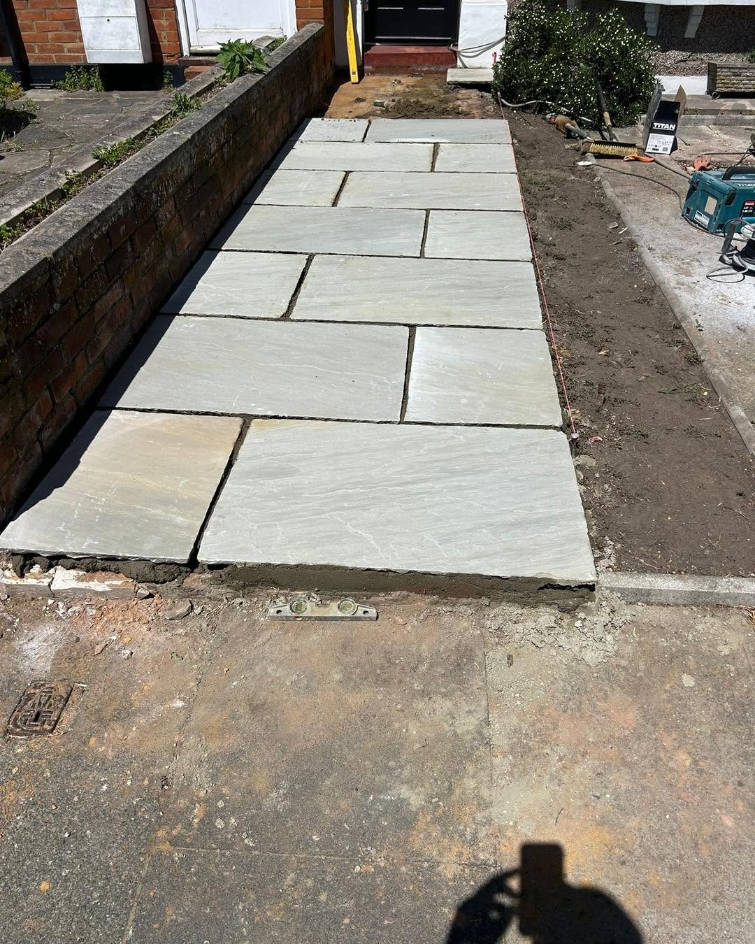 New front path and step laid to a front door